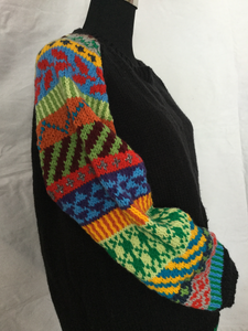 black hand knit pullover with multi color sleeves